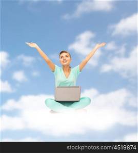 people, computing and technology concept - happy young woman with laptop computer sitting on cloud over blue sky background