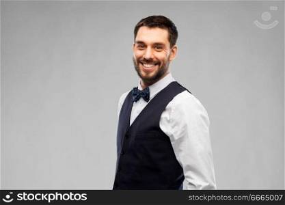 people concept - happy man in party clothes over grey background. happy man in party clothes