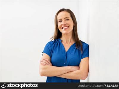 people concept - happy smiling middle aged woman. happy smiling middle aged woman