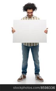 people concept - happy smiling young man in glasses holding big board over white background. smiling man in glasses holding big white board