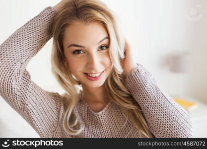 people concept - happy young woman or teenage girl at home. happy young woman or teenage girl at home