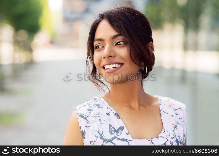 people concept - portrait of happy smiling indian woman outdoors. portrait of happy smiling indian woman outdoors