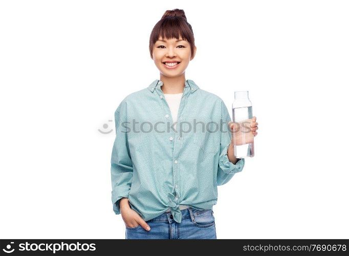 people concept - portrait of happy smiling young asian woman in turquoise shirt holding reusable glass bottle with water over white background. happy asian woman holding glass bottle with water