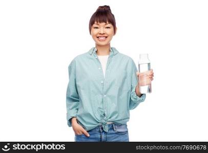 people concept - portrait of happy smiling young asian woman in turquoise shirt holding reusable glass bottle with water over white background. happy asian woman holding glass bottle with water