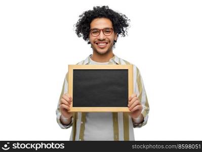 people concept - smiling young man in glasses holding chalkboard over white background. smiling man with chalkboard over white background
