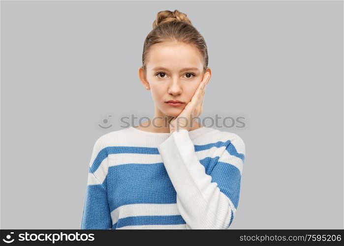 people concept - teenage girl in pullover over grey background. teenage girl in pullover