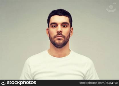 people concept - young man portrait over gray background. young man portrait over gray background. young man portrait over gray background
