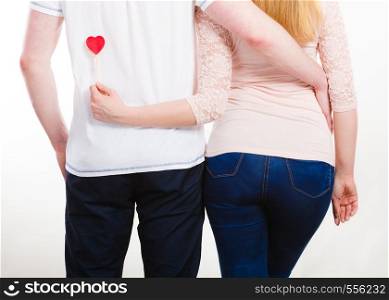 People connected by love. Rear view of girlfriend and boyfriend in hug. Enamoured couple showing their feelings by touch.. Rear view of hugging couple.