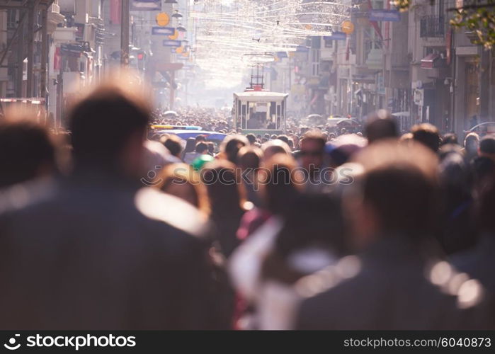 people crowd walking on busy street on daytime