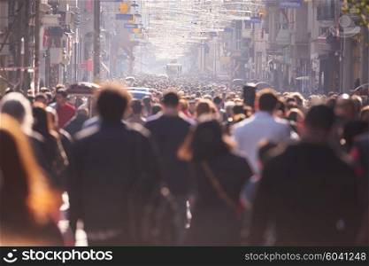 people crowd walking on busy street on daytime
