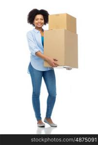 people, delivery, shipping, mail and moving concept - happy african american young woman holding cardboard boxes or parcels