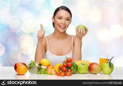 people, diet, gesture and vegetarian concept- happy asian woman with healthy food showing thumbs up over blue lights background