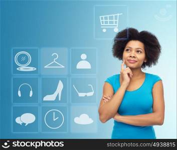 people, e-commerce and online shopping concept - happy afro american young woman over blue background with menu icons. happy afro american young woman with menu icons