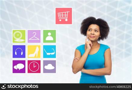 people, e-commerce and online shopping concept - happy afro american young woman over gray grid background with menu icons. happy afro american young woman with menu icons