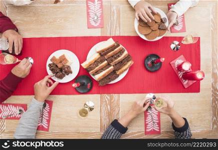 people eating dessert christmas table