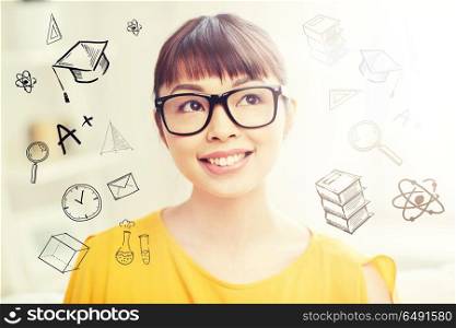 people, education and school concept - happy asian young woman or teenage student girl in glasses at home with doodles. happy asian young woman in glasses at home. happy asian young woman in glasses at home
