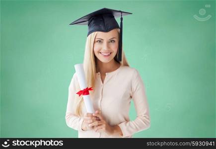 people, education, high school and graduation concept - happy student girl in bachelor cap with diploma over green chalk board background