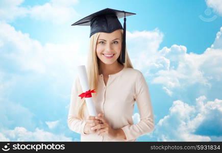 people, education, high school and graduation concept - happy student girl in bachelor cap with diploma over blue sky and clouds background