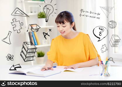 people, education, high school and learning concept - happy asian young woman student with book and notepad writing at home over doodles