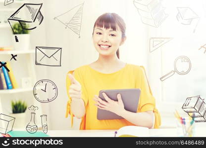 people, education, high school and learning concept - happy asian young woman student with tablet pc computer, book and notepads writing at home with doodles. happy asian woman student with tablet pc at home. happy asian woman student with tablet pc at home