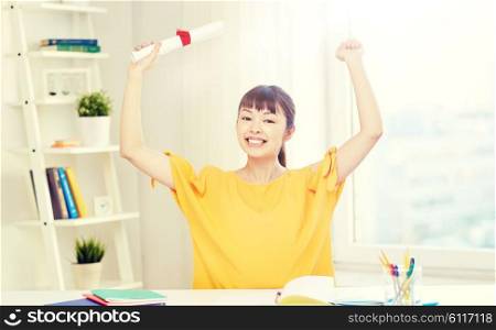 people, education, school, graduation and learning concept - happy asian young woman student with diploma scroll celebrating at home. happy asian woman student with diploma at home. happy asian woman student with diploma at home