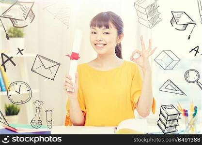 people, education, school, graduation and learning concept - happy asian young woman student with diploma scroll at home showing ok hand sign with doodles. happy asian woman student with diploma at home. happy asian woman student with diploma at home