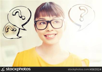 people, education, search and dilemma concept - happy asian young woman or teenage student girl in glasses over question marks. happy asian woman in glasses over question marks. happy asian woman in glasses over question marks