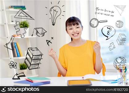 people, education, success and learning concept - happy asian young woman student with tablet pc computer, book and notepads at home over school doodles