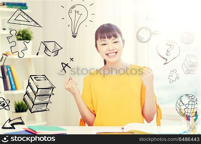 people, education, success and learning concept - happy asian young woman student with tablet pc computer, book and notepads at home over school doodles. happy asian young woman student learning at home. happy asian young woman student learning at home