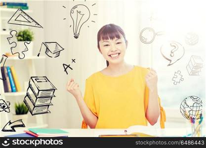 people, education, success and learning concept - happy asian young woman student with tablet pc computer, book and notepads at home over school doodles. happy asian young woman student learning at home. happy asian young woman student learning at home