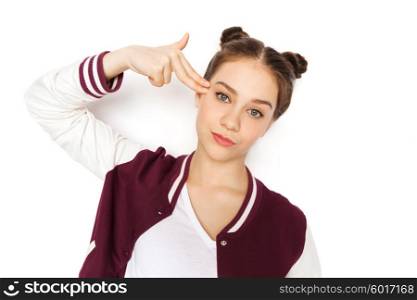 people, emotion, expression, stress and teens concept - bored teenage girl making headshot by finger gun gesture