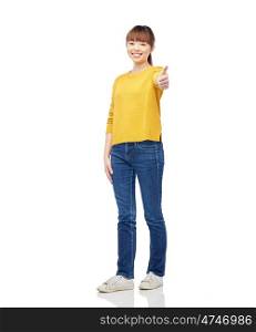 people, ethnicity and gesture concept - happy asian young woman showing thumbs up over white
