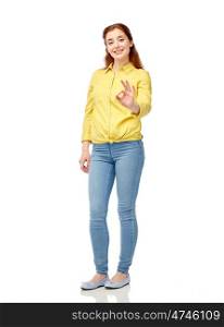 people, ethnicity and gesture concept - happy young woman showing ok hand sign over white