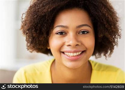 people, ethnicity and portrait concept - close up of happy african american young woman face. close up of happy african young woman face