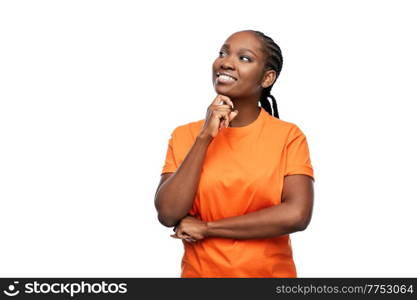 people, ethnicity and portrait concept - happy young woman dreaming over white background. happy woman dreaming over white background