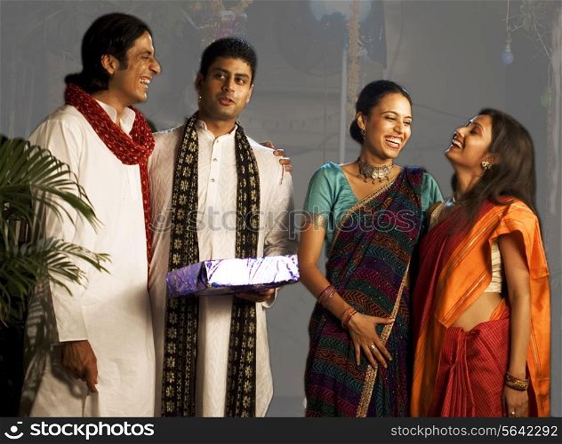 People exchanging gifts on Diwali