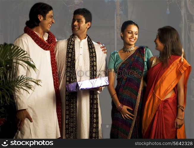 People exchanging gifts on Diwali