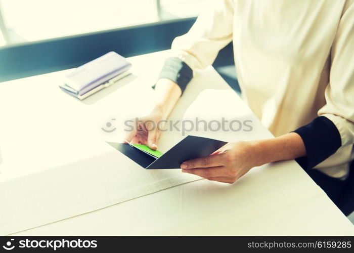 people, expenses, payment and lifestyle concept - close up of woman hands holding restaurant bill