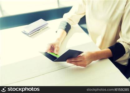 people, expenses, payment and lifestyle concept - close up of woman hands holding restaurant bill