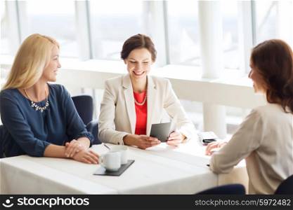people, expenses, payment and lifestyle concept - happy women looking at restaurant bill