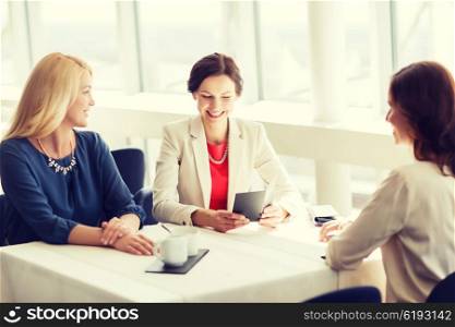 people, expenses, payment and lifestyle concept - happy women looking at restaurant bill