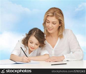people, family, school, home education and parenting concept -happy mother and daughter doing homework and writing in notebook over blue sky background
