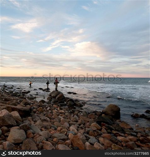 People fishing off the Hampton shoreline