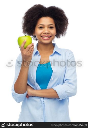 people, food, healthy eating and dental care concept - happy african american young woman with green apple