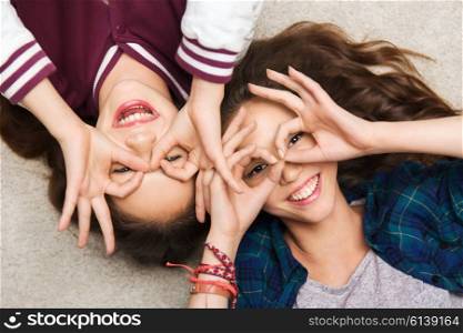 people, friends, teens and friendship concept - happy smiling pretty teenage girls having fun and making faces