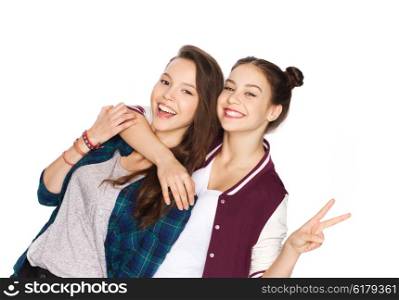 people, friends, teens and friendship concept - happy smiling pretty teenage girls hugging and showing peace hand sign