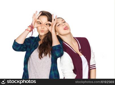 people, friends, teens and friendship concept - happy smiling pretty teenage girls having fun and making faces