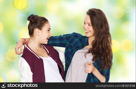 people, friends, teens and friendship concept - happy smiling pretty teenage girls hugging