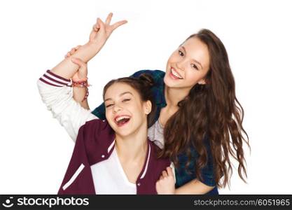 people, friends, teens and friendship concept - happy smiling pretty teenage girls showing peace hand sign
