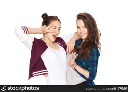 people, friends, teens and friendship concept - happy smiling pretty teenage girls showing peace hand sign